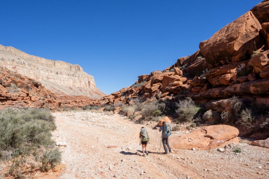 Hikers on a desert trail to Havasu Falls