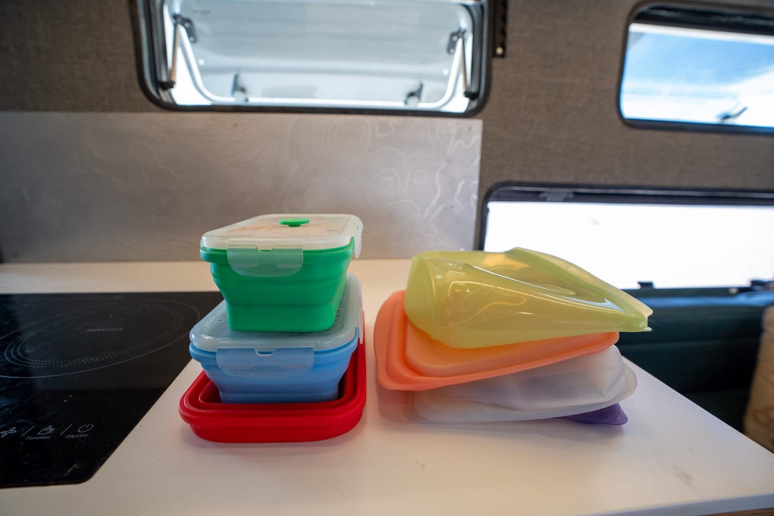 silicon tupperware and stasher bags on counter in Rossmonster Baja truck camper