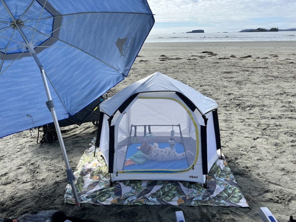 Veer basecamp beach tent set up on Cox Bay in Tofino with a baby inside