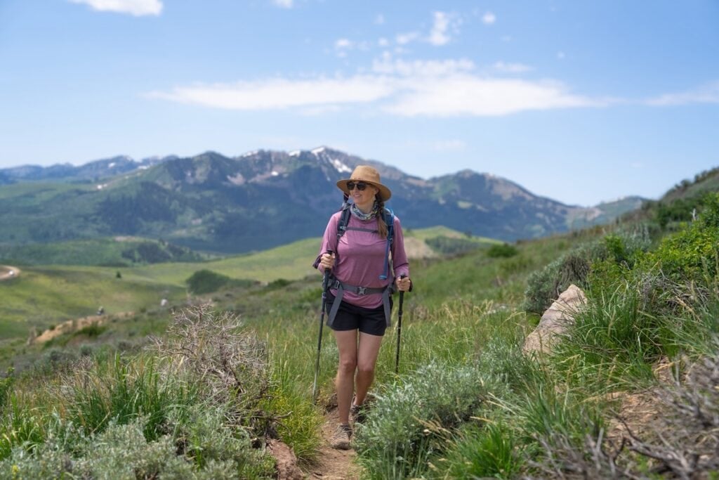 Kristen Bor hiking with Black Diamond FLZ trekking poles at Deer Valley on a summer day