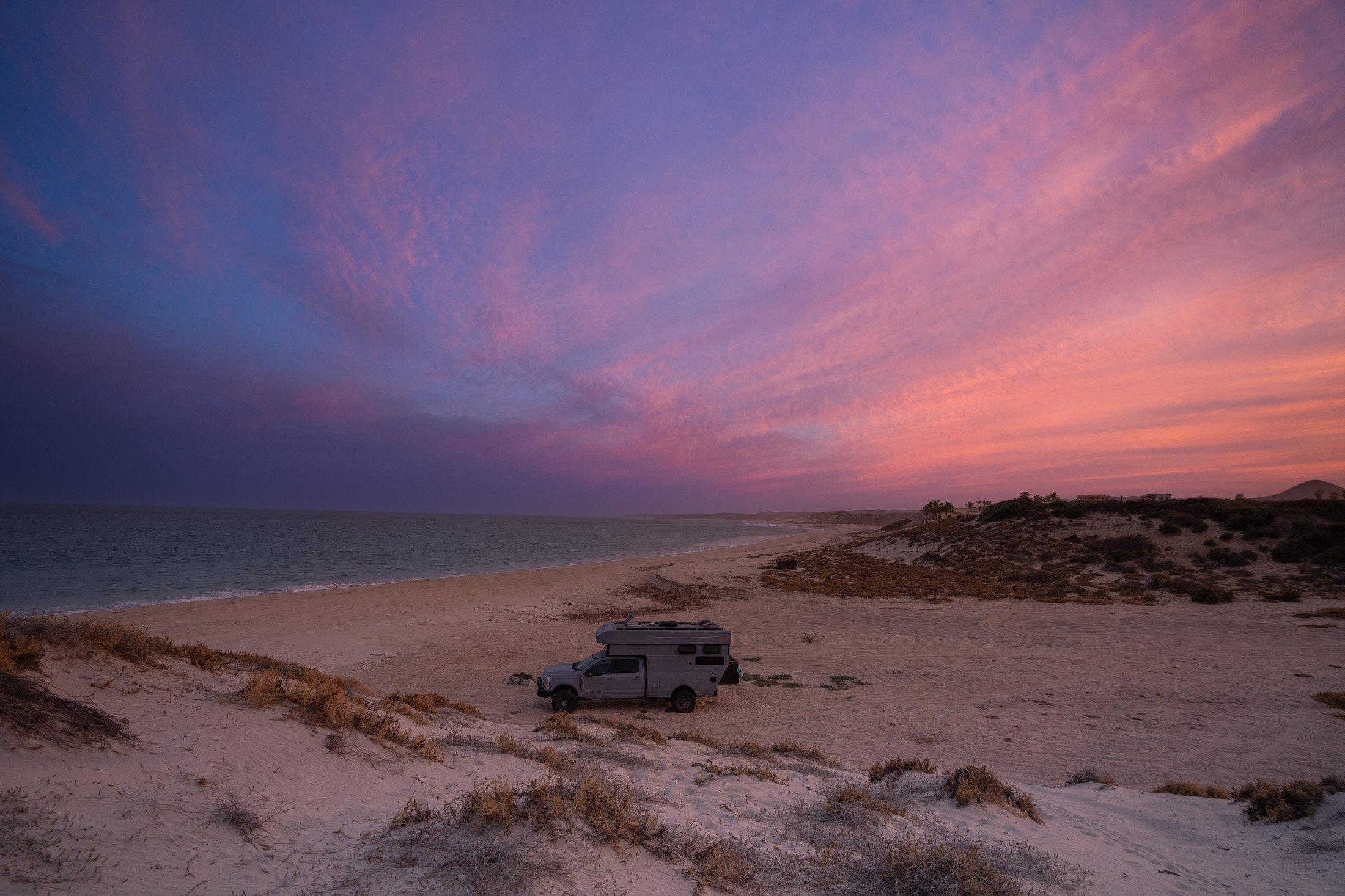 Rossmonster adventure truck parked at a free beach campsite in Baja during sunset